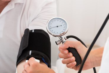 Close-up Of A Doctor Checking Blood Pressure Of Patient